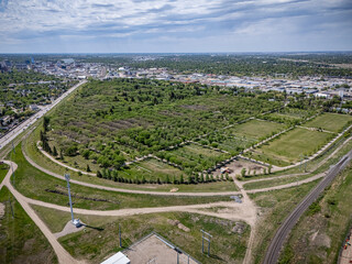 Large green field with a cemetery in the middle