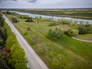 Road with trees and a river in the background
