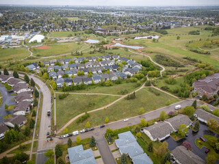 View of a residential area with houses and a park