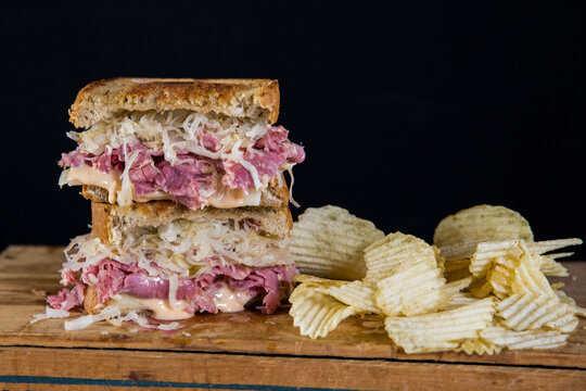 Reuben, hot corned beef, Swiss, sauerkraut and Russian dressing on grilled rye
