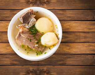 Beef rib broth with potatoes and cilantro - Traditional Colombian food