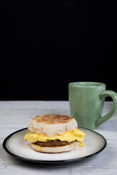 English muffin breakfast sandwich with coffee 