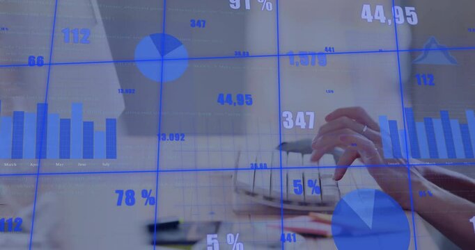 Blue data overlay appearing on desk, hands typing while updating monthly stats for timely insights