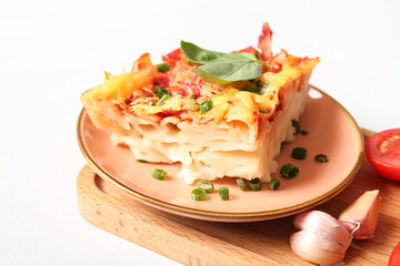 Plate of pasta with tomato sauce and cheese on grey background
