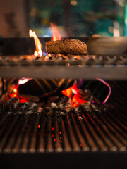 beef steak sizzling on an open flame grill