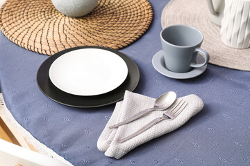 Stylish table setting with cups for tea party in room. Closeup