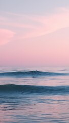 Obraz premium Calm Ocean Waves Under Pink Pastel Sunset Sky