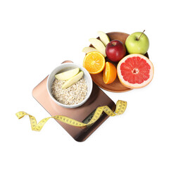 Electronic kitchen scales, fruits, oatmeal and measuring tape isolated on white, above view