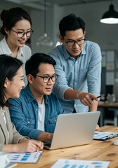 Business People Discussing Project On Laptop In Bright Office Meeting
