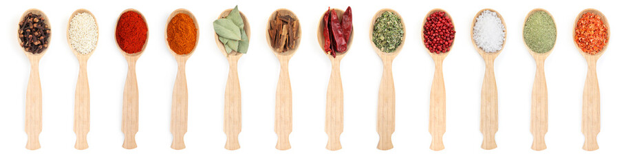 Different aromatic spices in wooden spoons on white background, set. Top view