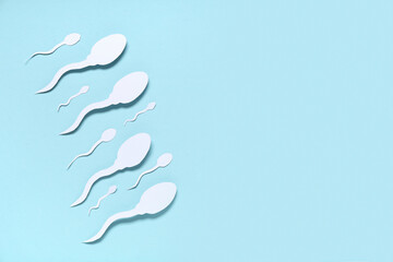 Sperm cells on blue background
