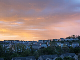 Colorful sunrise sky over suburban homes outside Pittsburgh Pennsylvania