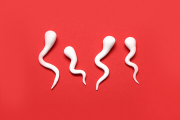 Sperm cells on red background