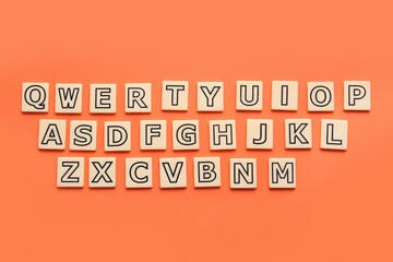 English letters on orange background