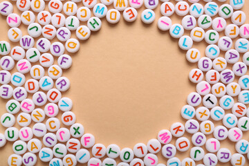 Frame made of English letters on beige background