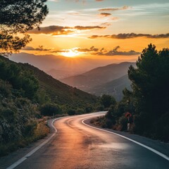 Winding mountain road at sunset