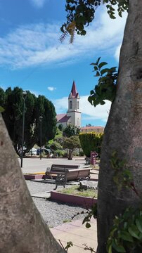 White Historic Church Tower Against Bright Blue Sky San Agustin Parish Puerto Octay