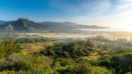 Naklejka premium Breathtaking panoramic sunset view of lush green mountains in Poipu, Kauai, Hawaii, with misty ocean horizon, rugged terrain, blue sky, peaceful tropical atmosphere evoking tranquility natural beauty