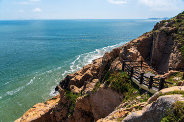 Breathtaking Coastal View with Dramatic Cliffs and Serene Waters
