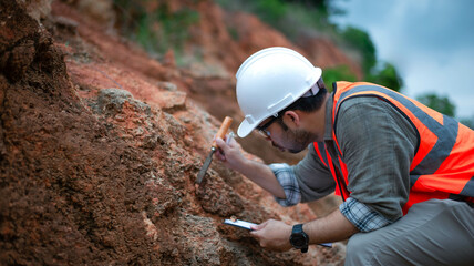 A geologist is examining the rock layers of a mountain.