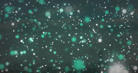 Image of glowing spots over cityscape and sky