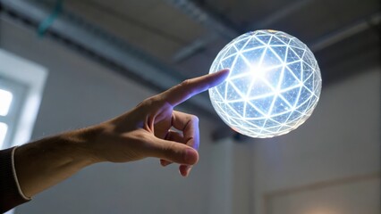 A hand reaching towards a glowing geometric sphere in a modern setting.