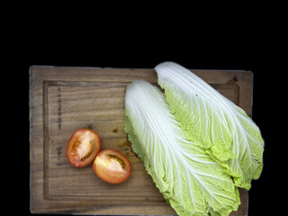 Chinese cabbage is a leafy vegetable with broad leaves that are light green to pale white, with...