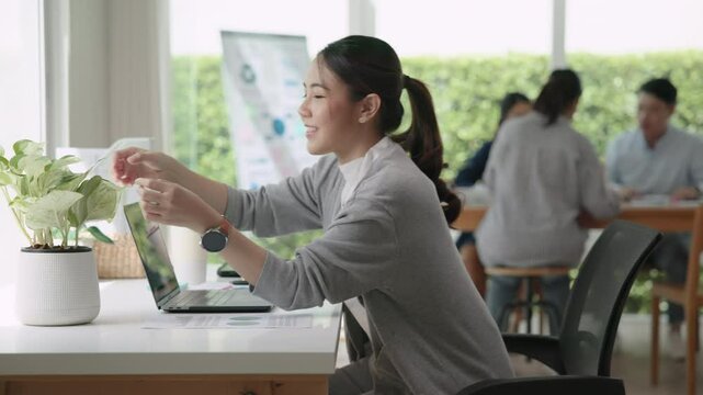 The way forward save the planet earth Gen Z asia people go green mindset net zero waste ESG SDG office nature house plant mental health care stress relief. Young adult woman asian happy smile relax.