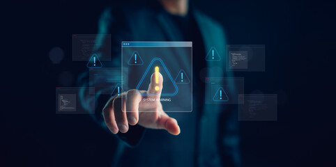 Cybersecurity warning concept with hand pressing virtual alert icon on screen, representing system error, malware risk, and data breach prevention in digital networks and IT infrastructure.