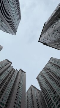 Vietnam, Nha Trang - 29.05.2025 - Skyscrapers, view from the bottom up, large buildings, man, high-rise building in Asia, luxury residential complex Oceanus, Muntian