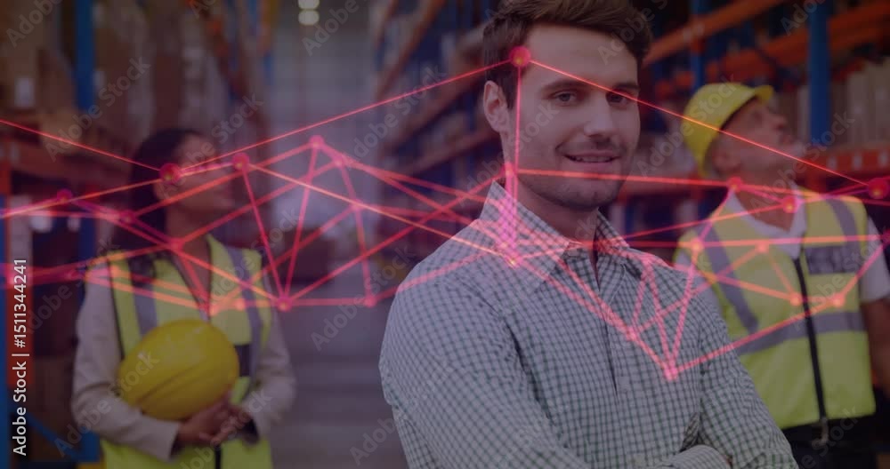 Poster warehouse manager turning toward camera as network overlay fading in and analyzing inventory