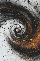 Abstract swirl of black ash and orange dust creates dynamic, energetic spiral on white background