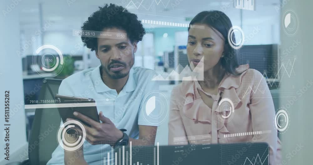 Poster man tapping tablet screen scrolling while colleague tracking floating graphs on laptop for business