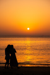 silhouette of a couple at sunset