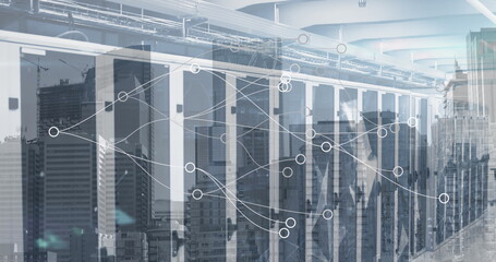 Image of network of connections over server room and cityscape
