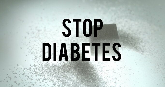 Fototapeta Image of stop diabetes text over cube of sugar