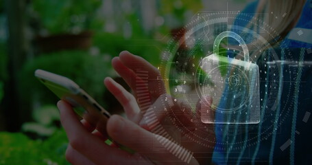 Image of digital padlock over hands of caucasian woman using smartphone