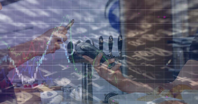 Image of graphs over hands of caucasian people using payment terminal