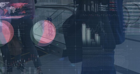 Image of graphs and financial data over low section on businessman walking to escalator