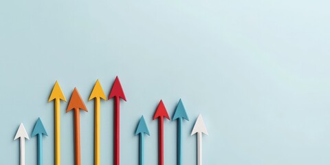 Colorful arrows pointing upward on a light blue background, symbolizing growth, progress, and success.