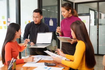 Group of Asian business people working together in an office