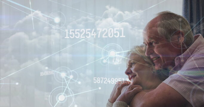 Image of data processing over senior caucasian couple smiling
