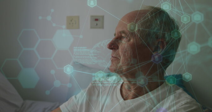 Reclining senior man wearing white shirt gazing at holographic network on hospital bed, copy space - Powered by Adobe