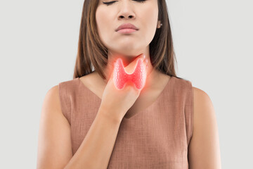 A woman is depicted holding her throat, with a superimposed image of the thyroid gland, suggesting...