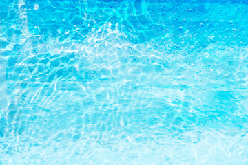 Blue water with ripples on the surface. Defocus blurred transparent blue colored clear calm water...