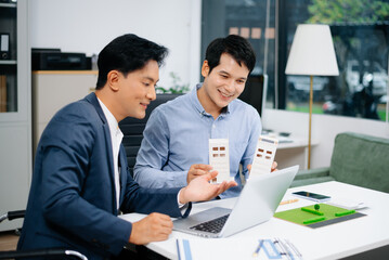 Signing a contract. Client and broker agent, lease agreement, successful deal and  Young business sitting at the desk