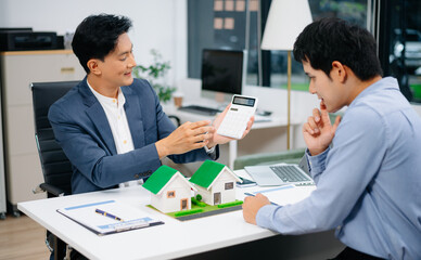 Real Estate Business Deal with Asian Salesmen and House Model