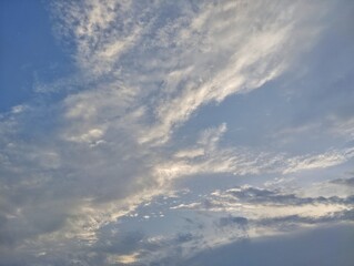 	
Bright blue sky with scattered clouds in the morning, summer sky landscape	
