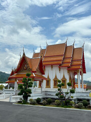 Naklejka premium Ornate Chapel at Wat Luang Pu Supa Temple Surrounded by Tranquil Temple Grounds in Phuket, Thailand