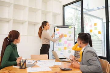 Group of Asian business people working together in an office